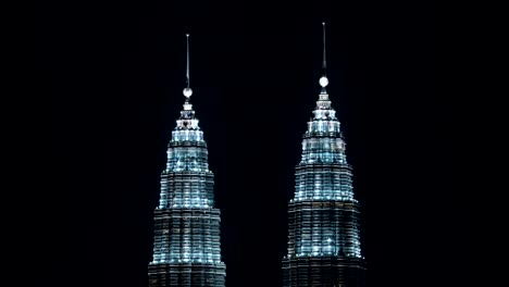 Timelapse-of-illuminated-Petronas-Twin-Towers,-Kuala-Lumpur