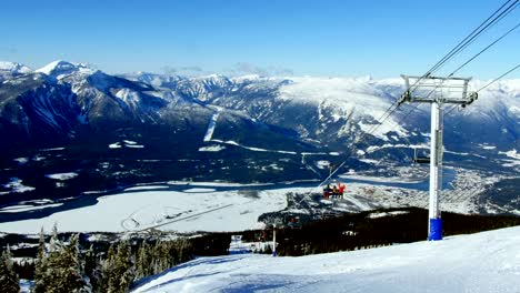 Overhead-cable-cars-above-snowcapped-mountain