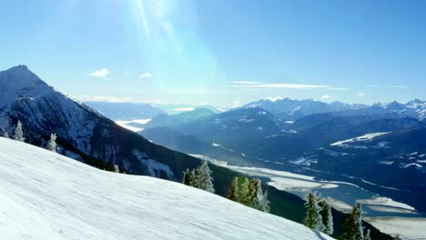 Person-snowboarding-on-snowy-mountain