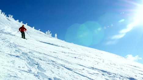 Person-snowboarding-on-snowy-mountain