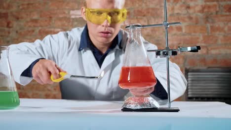 A-scientist-conducts-an-experiment-and-his-hand-lights-up