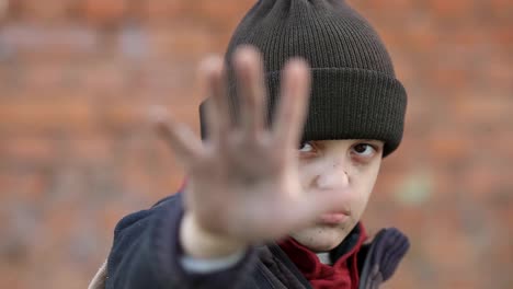 dramatic-portrait-of-a-little-homeless-boy