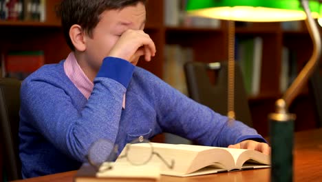 portrait-of-schoolboy-doing-their-homework-and-sleeping-on-the-book