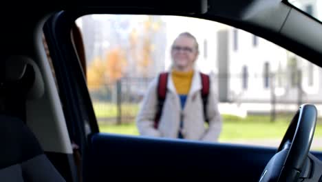 Affectionate-mother-taking-her-daugther-to-school