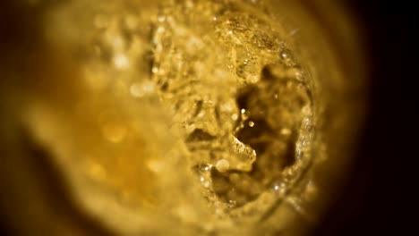 Closeup-slow-motion-pouring-beer-in-glass