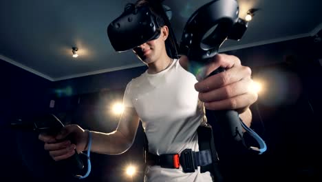 Equipped-teenage-guy-is-exploring-virtual-reality-with-the-help-of-a-simulator