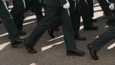 Soldier-of-military-army-walking-in-boots-closeup-in-the-parade-of-city-square.