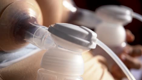 Close-up--mothers-using-automatic-breast-pump