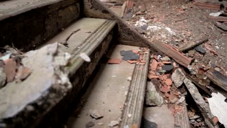 CLOSE-UP:-Detail-of-ruined-cracked-stone-staircase-in-decaying-abandoned-castle