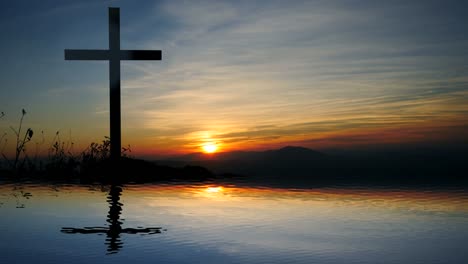 Cross-of-Jesus-Christ-near-Water-with-Sunset-and-Peaceful-Mood.
