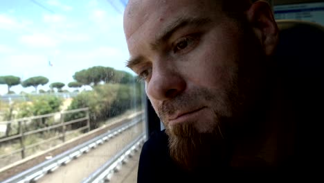 Pensive-and-sad-man-on-train:-problem,sadness,-depression