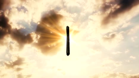 Cross-In-The-Sky-With-Moving-Clouds-and-Sun-Rays-In-The-Background.-Catholic-Religion-Concept