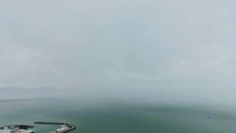 Dramatic-atmosphere-Time-lapse-video-clip-of-The-heavy-rainstorm-moving-from-the-ocean-to-the-land-strike-small-boat.