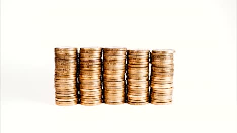 Stop-motion-reduction-of-a-pile-of-gold-coins,-reduced-investment-and-reduced-profits-on-a-white-isolated-background.