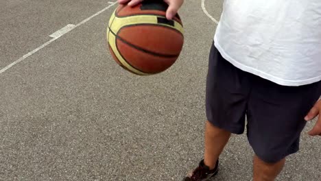 Basketball-player-dribbles-the-ball