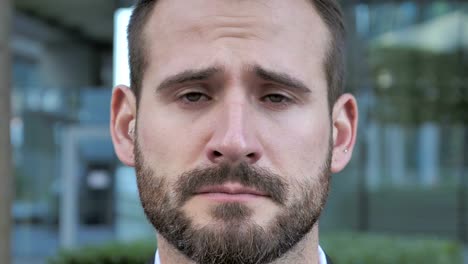 Face-of-Sad-Beard-Businessman