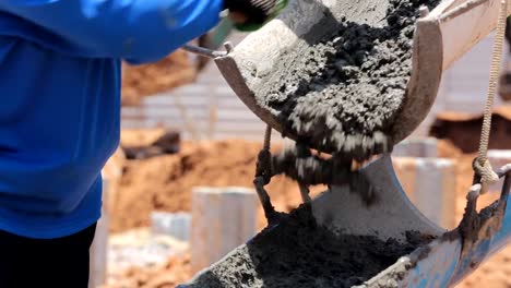 Cement-truck-is-pouring-cement-on-building-site