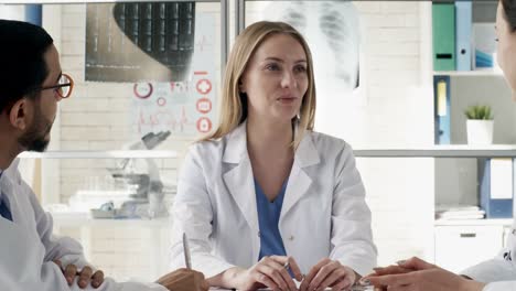 Doctors-Discussing-Work-at-Meeting-in-Clinic