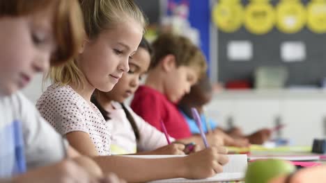 Smiling-girl-doing-classwork