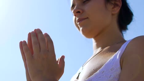 Grateful-beautiful-woman-hands-in-namaste-pose-reading-prayer-to-God,-meditation