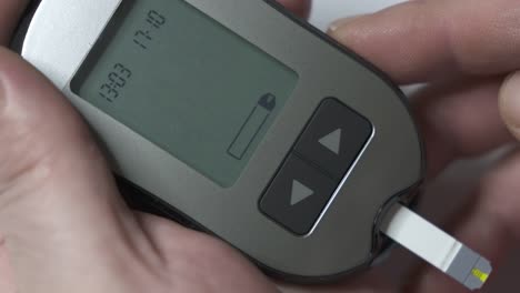 Patient-with-diabetes-using-a-blood-glucose-meter-to-test-blood-glucose