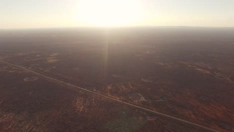 Aerial-drone-images-of-the-road-in-the-Brazilian-semi-arid-region,-plain-landscape-and-sunlight