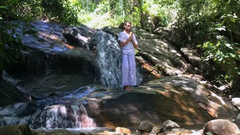 Eastern-guru-teacher-standing-alone-in-mountains.