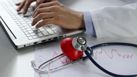 cardiology---doctor-cardiologist-working-on-laptop-computer-in-office