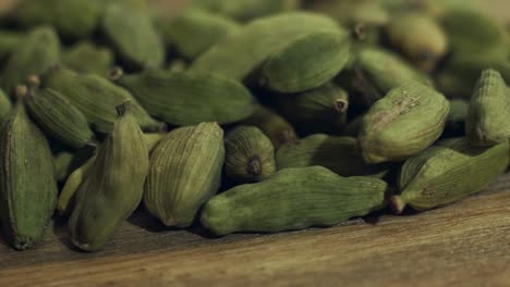 green-cardamom-on-a-wooden-table.-4k