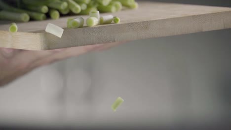 Falling-of-green-onion.-Slow-motion-240-fps