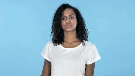 African-Girl-Waving-Finger-to-Refuse-Isolated-on-Blue-Background