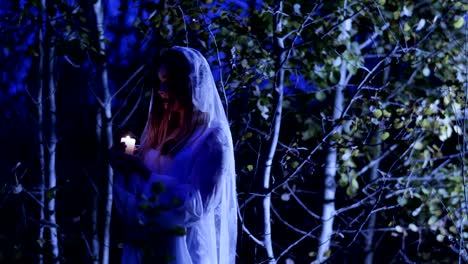 La-joven-con-maquillaje-esqueleto-para-Halloween-en-el-vestido-de-novia-blanco.-4K