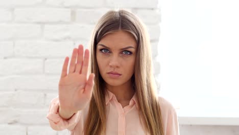 Stop,-Gesture-by-Woman-in-Office