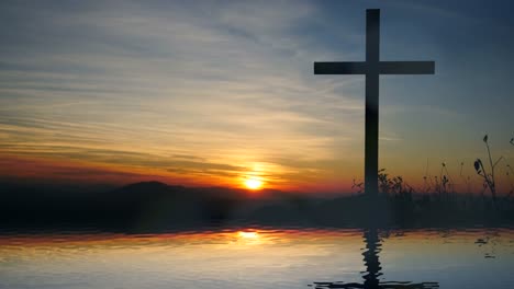 Cross-of-Jesus-Christ-near-Water-with-Sunset-and-Peaceful-Mood.