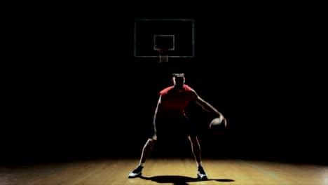 A-basketball-player-dribbling-and-practicing-on-the-court.