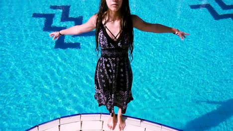 Young-girl-in-dress-falling-to-swimming-pool