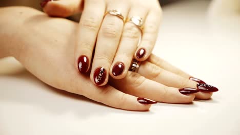 Beautiful-woman's-hands-with-perfect-manicure-at-beauty-salon.