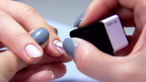 Professional-manicure-procedure-in-beauty-salon