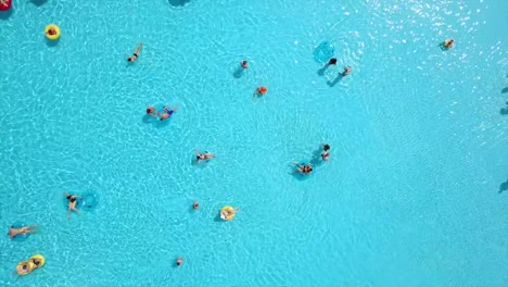 summer-day-outdoor-swimming-pool-aerial-down-view-panorama-4k