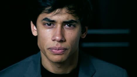 sad-and-depressed-young-man-cries-looking-at-the-camera