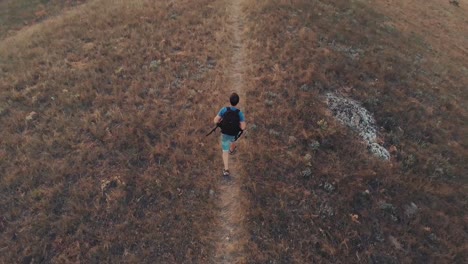 Man-with-backpack-hiking-aerial-view