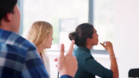 Female-High-School-Tutor-At-Whiteboard-Teaching-Maths-Class-With-Pupil-Asking-Question