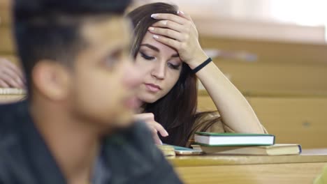 Bored-Female-Student-Using-Smartphone