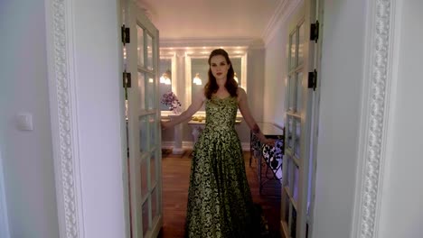 Beautiful-woman-in-a-long-dress-from-the-room.