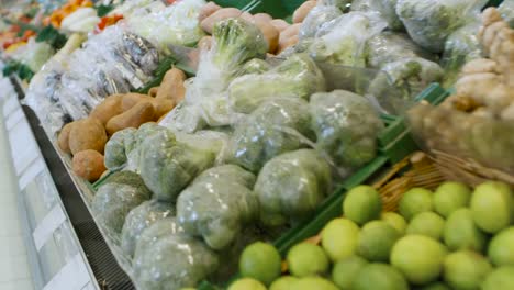 At-the-Supermarket:-Gliding-Shot-of-the-Fresh-Produce-Section-of-the-Store.-Exotic-Fruits-and-Organic-Vegetables-on-Sale-in-the-Farmer's-Market.