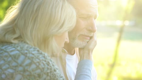 Old-woman-supporting-and-hugging-her-ill-crying-husband,-bad-news,-despair