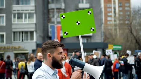 Man-at-political-meeting-with-banner-with-points-for-tracking-to-copy-space-text