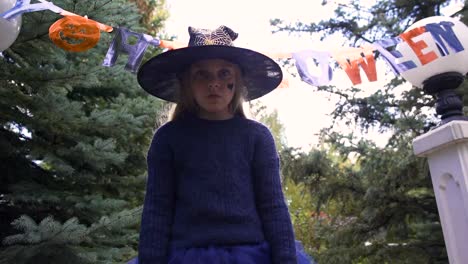 Little-witch-kid-demands-sweets,-children-trick-or-treating,-Halloween-event