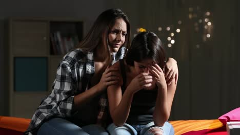 Girl-comforting-to-her-sad-friend-at-home