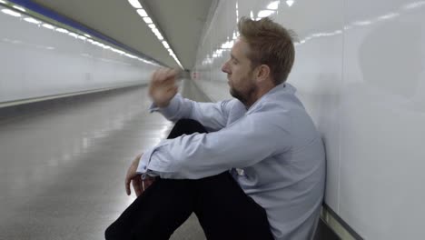 Desperate-sad-young-businessman-suffering-emotional-pain-grief-and-deep-depression-sitting-alone-in-tunnel-subway-in-Stress-life-style-Work-problems-failure-Unemployment-Mental-health-and-Depression.